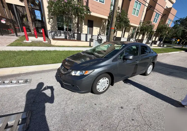 The same Honda Civic on a street at delivery in Tampa, Florida