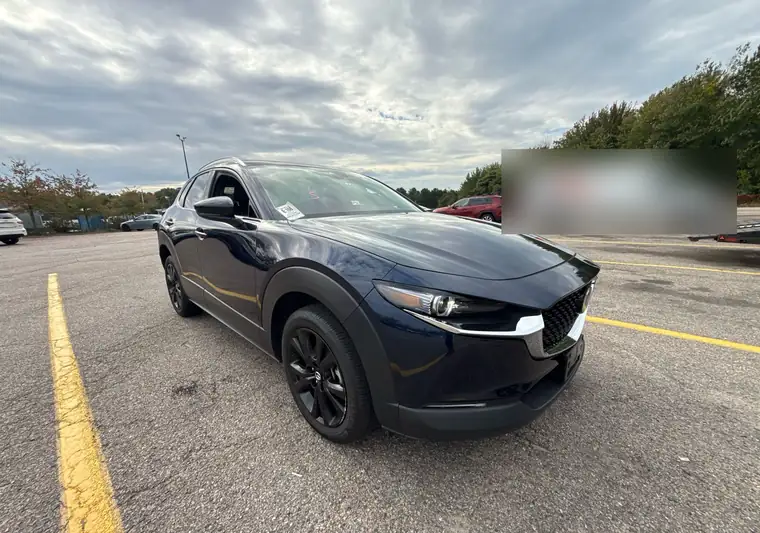 Dark blue 2023 Mazda CX-30 in a parking lot in Taunton, Massachusetts