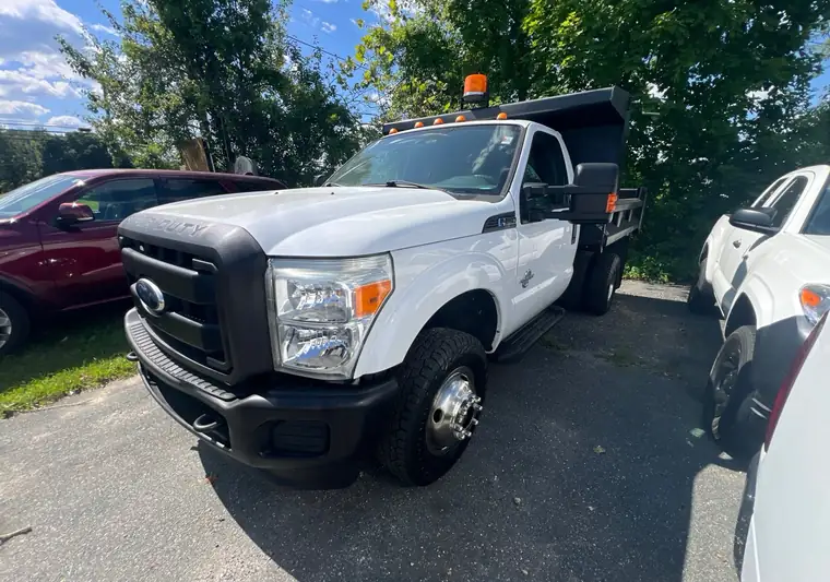 White Ford F-350 Super Duty dump truck on an asphalt lot in Jarrettsville, Maryland