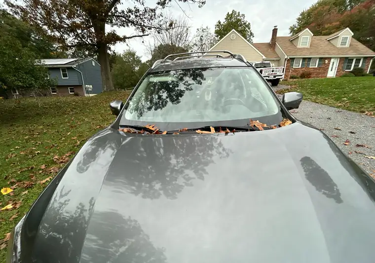Gray 2018 Nissan Rogue parked on a gravel drive in Reisterstown, Maryland