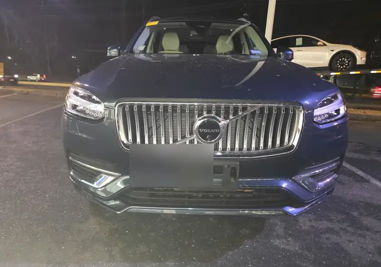 Dark blue 2023 Volvo XC90 at night at pickup in Rockville, Maryland