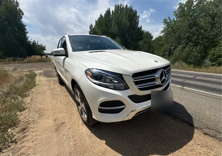 White 2017 Mercedes-Benz GLE 350 on a roadside in Boulder, Colorado