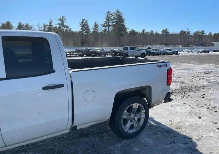 White 2019 Chevrolet Silverado 1500 crew cab on a gravel lot in Windham, Maine