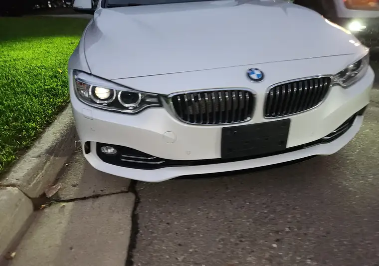 White 2017 BMW 4 Series convertible, front end, at pickup in Highland Township, Michigan