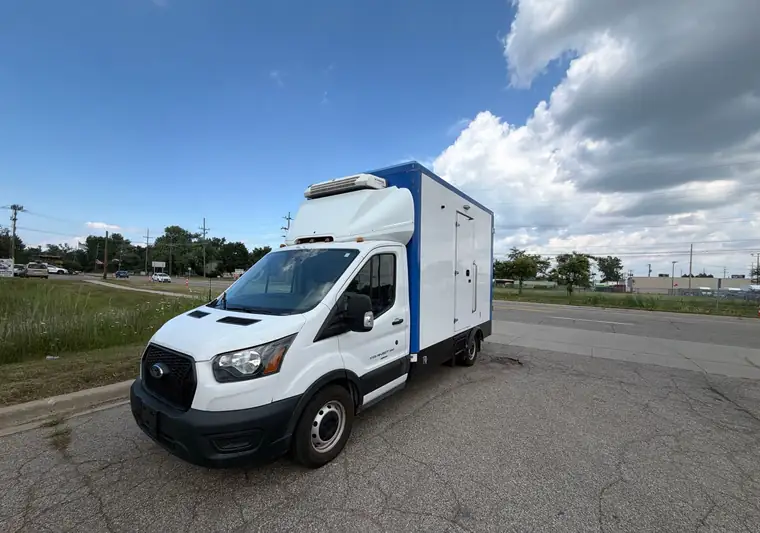 White 2023 Ford Transit box truck on a lot in Farmington Hills, Michigan