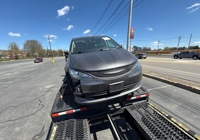 The same Voyager on the car hauler at delivery in Brockton, Massachusetts