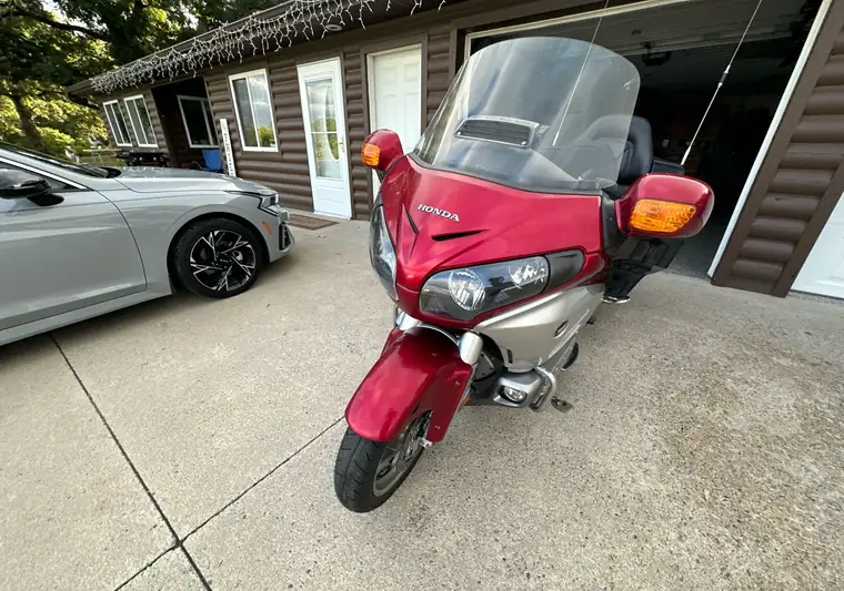 Red 2012 Honda Gold Wing motorcycle in a driveway in Clearwater, Minnesota