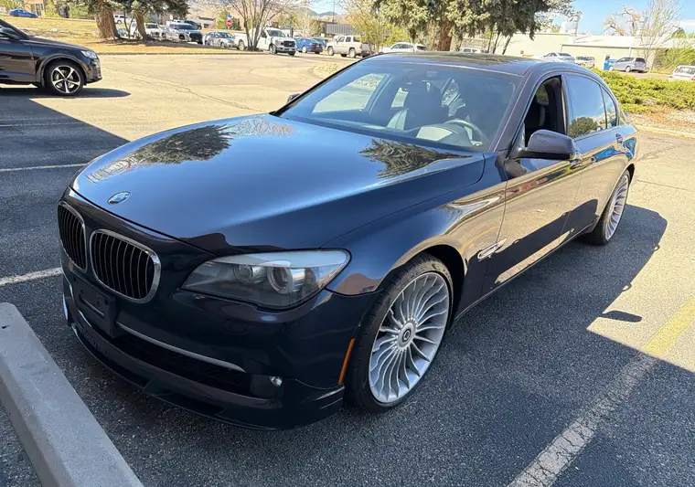 The same BMW 7 Series next to a parking curb at delivery in Boulder, Colorado