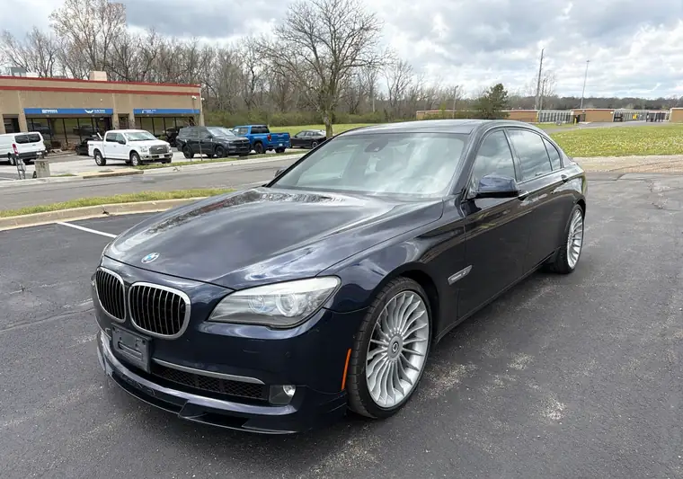 Dark blue 2012 BMW 7 Series in a parking lot at pickup in Kansas City, Missouri