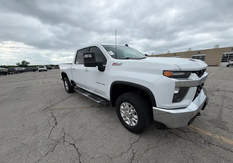 White 2023 Chevrolet Silverado 2500 HD in a parking lot at pickup in Kansas City, Missouri