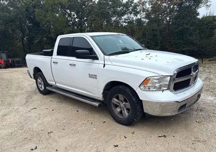 White 2016 Ram 1500 crew cab on a gravel lot at pickup in Barnett, Missouri