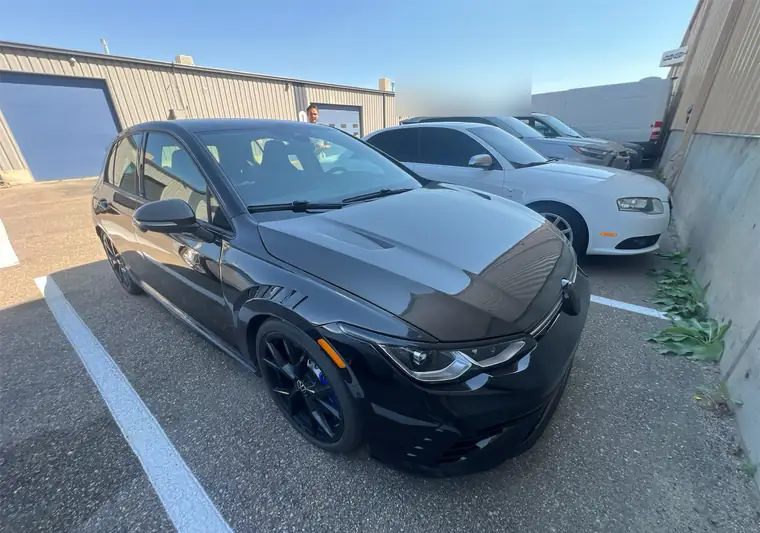 The same Golf R in a parking lot at delivery in Boulder, Colorado