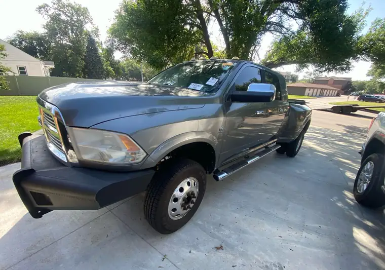 The same Ram 3500 on a concrete driveway at delivery in Lincoln, Nebraska