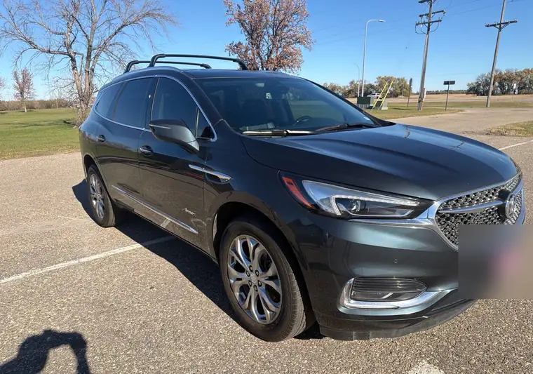 The same Buick Enclave in a parking lot near Minot Air Force Base, North Dakota at delivery