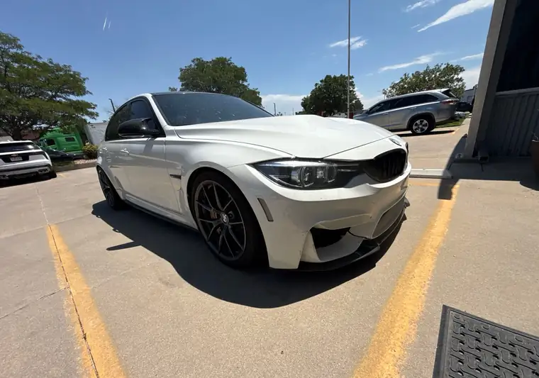 The same M3 in a parking lot at delivery in Broomfield, Colorado