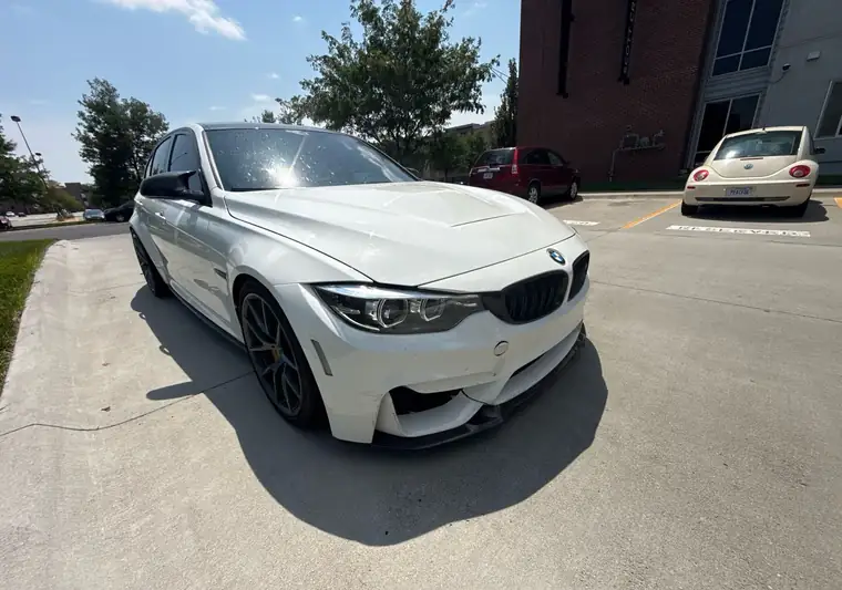 White 2018 BMW M3 in a parking lot at pickup in Omaha, Nebraska