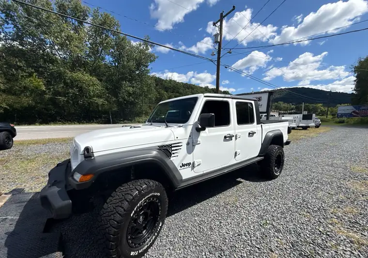 The same Jeep Gladiator on a gravel lot at delivery at a dealer near Shamokin, Pennsylvania