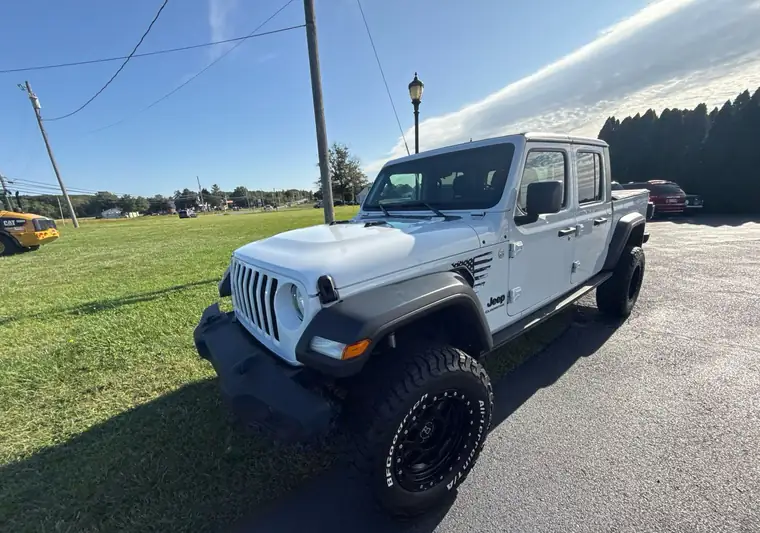 White lifted 2020 Jeep Gladiator pickup at pickup at a dealer in Allentown, New Jersey