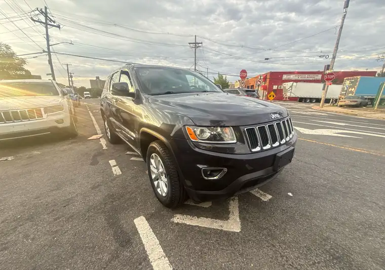 The same Grand Cherokee on a city street at delivery at a mechanic shop in the Bronx, New York
