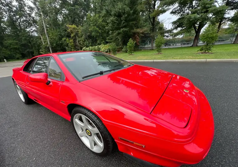 Red Lotus Esprit sports car parked on a street at pickup in northern New Jersey