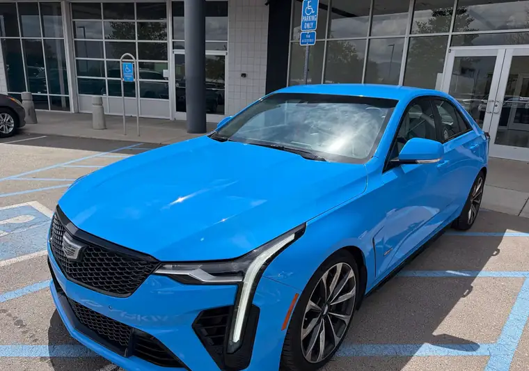 Light blue 2022 Cadillac CT4-V sedan at pickup at a dealer in Albuquerque, New Mexico