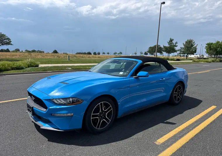 The same Mustang convertible in a parking lot at delivery in Loveland, Colorado