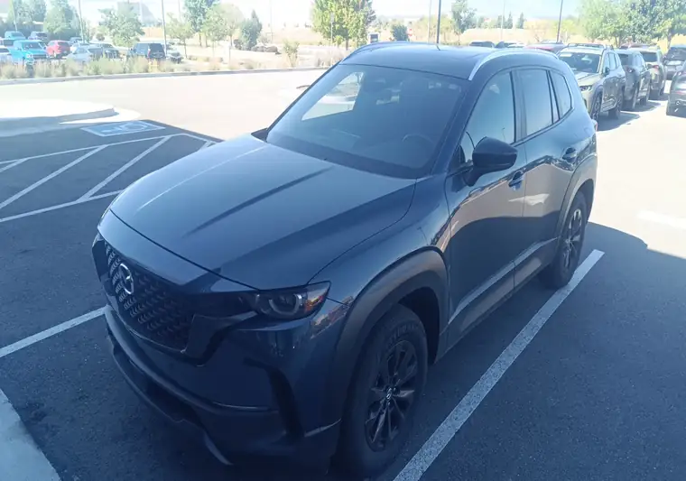 The same CX-50 Hybrid at delivery in a parking lot in Loveland, Colorado