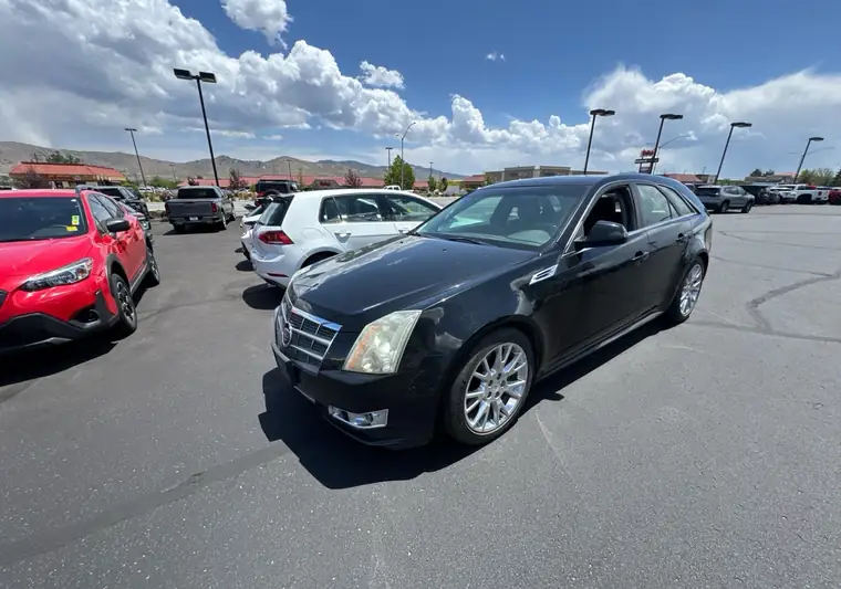 Black 2010 Cadillac CTS wagon at a dealer lot at pickup in Carson City, Nevada