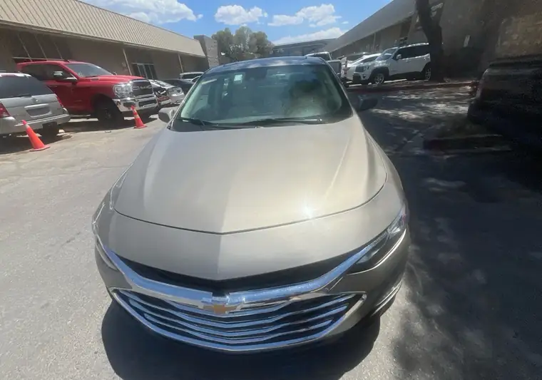 Tan 2024 Chevrolet Malibu in a parking lot at pickup in Las Vegas, Nevada