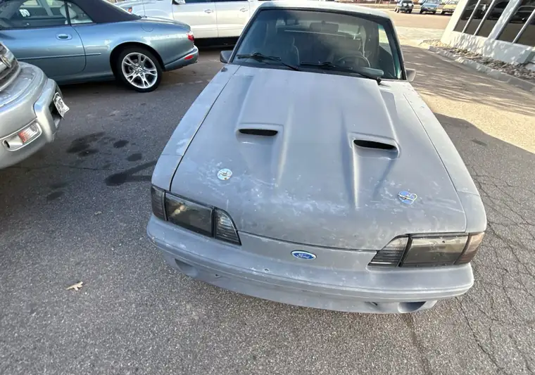 The same Mustang on a classic-car dealer lot at delivery in Greeley, Colorado