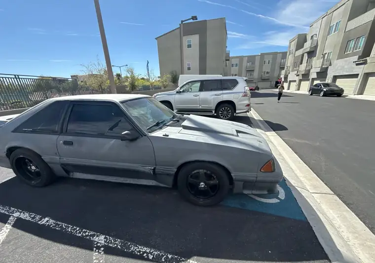 Gray 1990 Ford Mustang GT hatchback in a parking lot at pickup in Las Vegas, Nevada