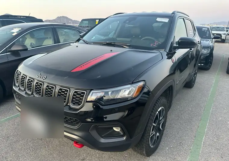 Black 2024 Jeep Compass Trailhawk in a lot at pickup in North Las Vegas, Nevada