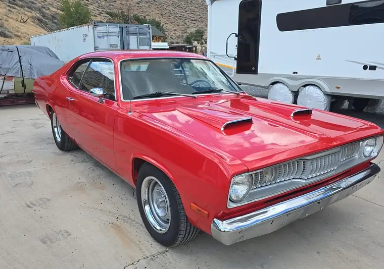 Red 1972 Plymouth Duster on a driveway at pickup in Dayton, Nevada