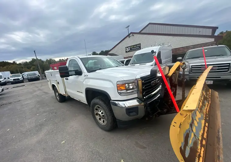 The same Sierra with the plow and a salt spreader at delivery in Rowley, Massachusetts