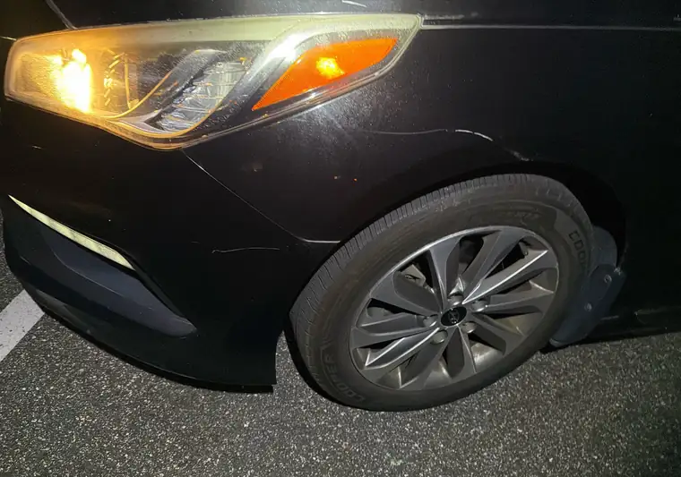 Close-up of the front corner of a black 2016 Hyundai Sonata at pickup in Northport, New York