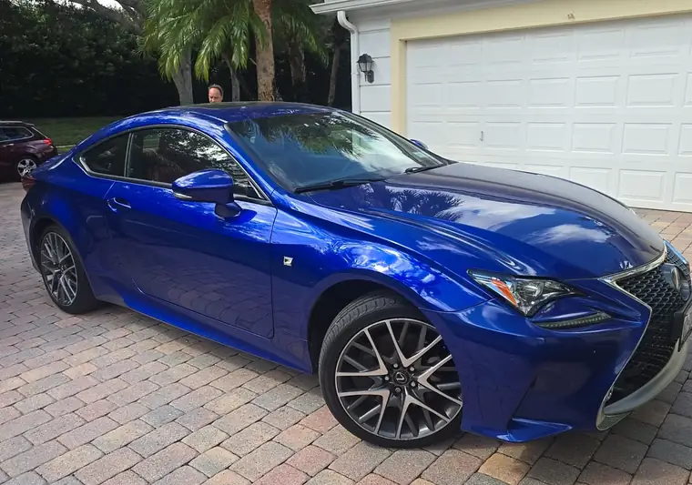 The same Lexus RC 350 on a paver driveway at delivery in Palm Beach Gardens, Florida