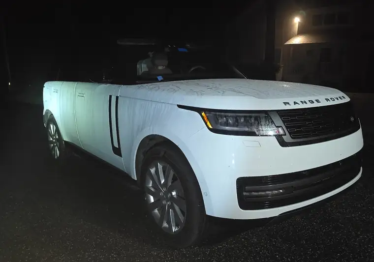 White 2025 Land Rover Range Rover photographed at night at pickup in the East Hampton area, New York