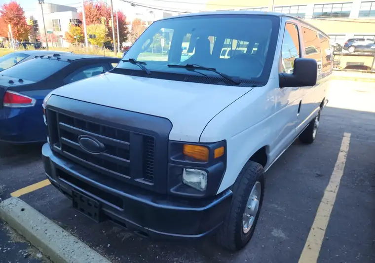 The same Ford E-Series van in a parking lot at delivery in Detroit, Michigan