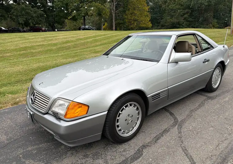 Silver 1992 Mercedes-Benz 300SL convertible with a hardtop on a street at pickup in Cincinnati, Ohio