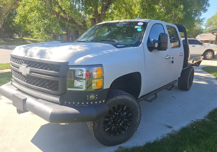 The same Silverado 2500HD on a driveway at delivery in Lincoln, Nebraska