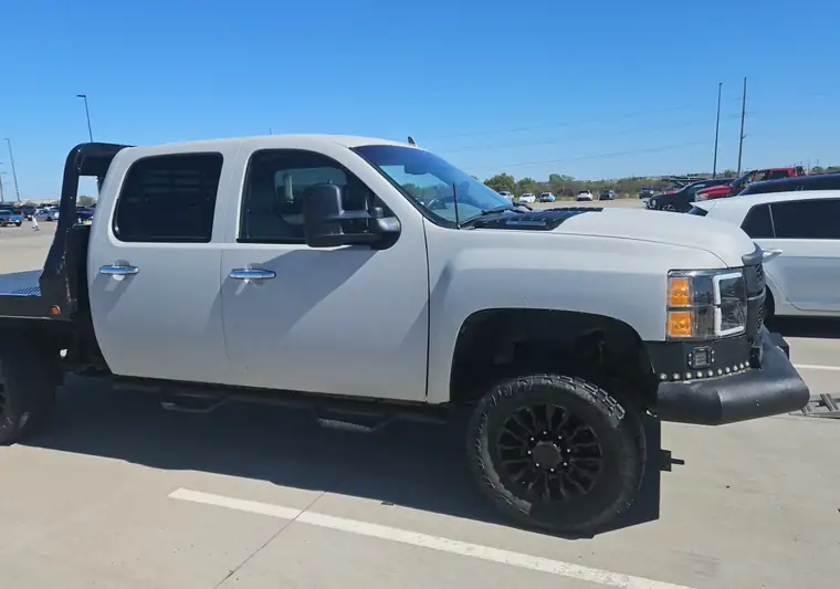 Silver 2014 Chevrolet Silverado 2500HD crew cab with a flatbed at pickup in Oklahoma City