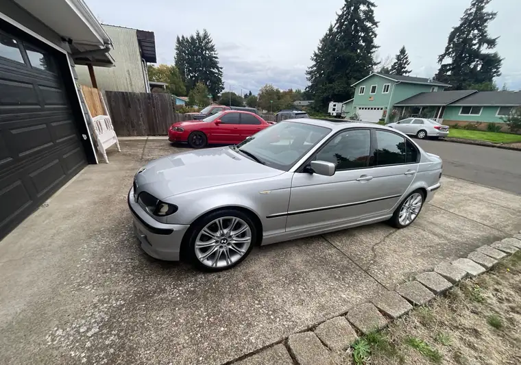 Silver 2004 BMW 3 Series sedan in a driveway at pickup in Eugene, Oregon