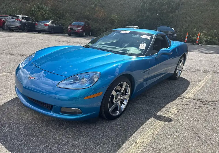 Blue 2009 Chevrolet Corvette coupe in a parking lot at pickup at an auction in Cranberry Township, Pennsylvania
