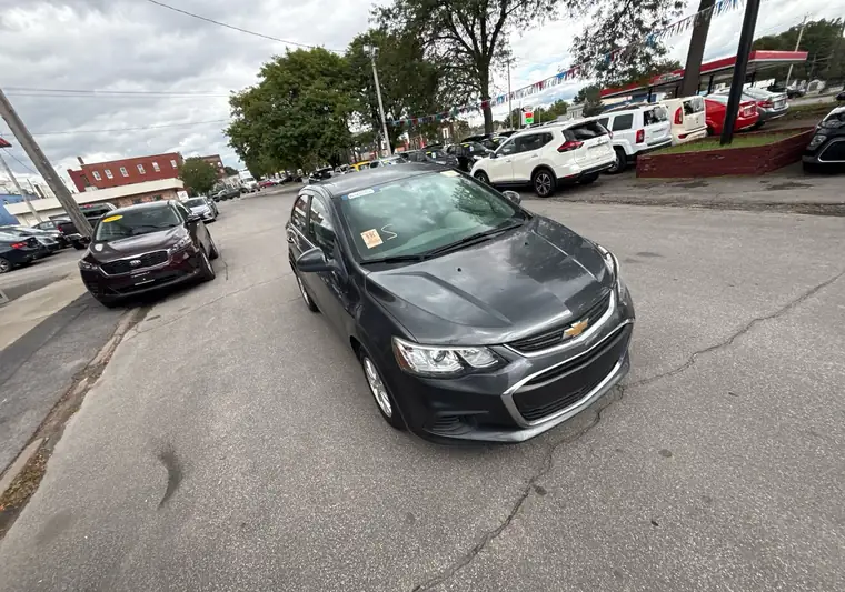 The same Chevrolet Sonic in front of a dealership at delivery in Herkimer, New York