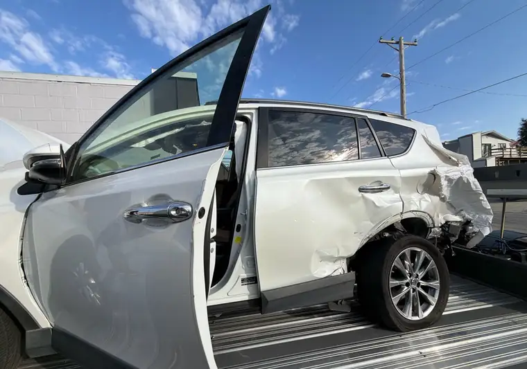 The same RAV4 on a hauler at delivery in Omaha, Nebraska with the door open