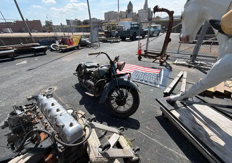 The same 1938 Indian Four motorcycle in a yard at delivery in Davenport, Iowa