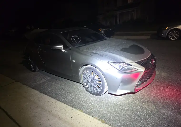 The same Lexus RC 350 on a street at night at delivery in Raleigh, North Carolina